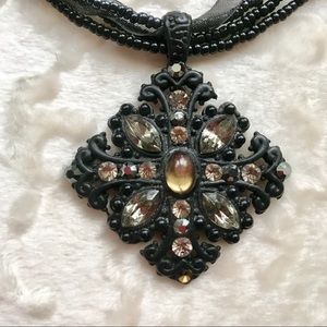 Celtic cross jeweled pendant on multistrand necklace